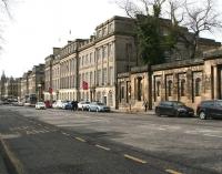 Looking west along Edinburgh's Waterloo Place towards Princes Street on 24 March 2017. The imposing building on the right is the Apex Hotel, one time headquarters of the North British Railway Company. The Calton Road entrance to Waverley Station can still be seen from the far end of the building [see image 52386].<br><br>[John Furnevel 24/03/2017]