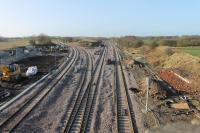 Electrification of the Blackpool line continues at Kirkham North Junction. This is the view towards Blackpool on 24th January 2018 with masts appearing and new signals in place, one directly in front of the site of the old mechanical signal box. The Blackpool South line, curving left, reopens on 29th January. [See image 63641] for the same location in 2001.<br><br>[Mark Bartlett 24/01/2018]