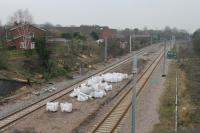 Looking east from the Station Road over bridge in Poulton-le-Fylde at electrification progress in January 2018. [See image 58363] for the same view in March 2017. Masts are now appearing and the semaphores have been removed. Station Road is confusing for the uninitiated as it leads to the site of the original station on the direct route to Fleetwood, which closed in 1896. <br><br>[Mark Bartlett 09/01/2018]