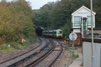 A Southern service to Brighton exits Bopeep Tunnel and crosses Bopeep Jct on 27 October 2017. The track in the foreground leads into West St Leonards station on the route from London via Tunbridge Wells. [Ref query 26 January 2018]<br><br>[John McIntyre 27/10/2010]