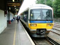 166221 awaits its departure time at Redhill platform 1 on 26 July 2002 with a Reading shuttle service.<br><br>[Ian Dinmore 26/07/2002]