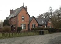 The station at Plowden on the Bishop's Castle Railway (closed 1935) was a very large station for a very small railway. There are still few houses around here, although the station building, incorporating the station master's house on the left, has been converted to two separate dwellings. [Ref query 28 January 2018]<br><br>[Ken Strachan 15/01/2018]