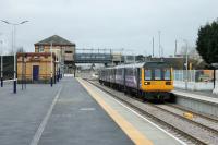 Second day of operations from the new third platform at Kirkham following reopening to Blackpool South services. A Pacer/Sprinter combination calls on 30th January 2018 with an eastbound service. The new footbridge is available to passengers although the lifts have not yet been installed. There is further work to be done on the new platform and of course the masts and wires have to be erected before Easter. <br><br>[Mark Bartlett 30/01/2018]