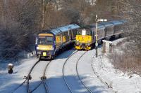 A double hold up at Dunblane on a sub-zero 20th January 2018. To the right is the Caledonian Sleeper running ECS between Aberdeen and Polmadie. To the left is the 12.13 service to Glasgow Queen Street. Both are waiting upon the 11.58 service to Edinburgh to clear the station.<br><br>[Mark Dufton 20/01/2018]