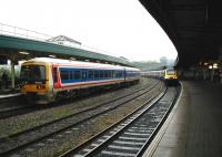 Platform scene at Bristol Temple Meads in the summer of 2002. On the left a Network South East liveried 165 forms a Thames Trains service to Oxford, alongside a First Great Western InterCity HST on the right.<br><br>[Ian Dinmore 07/06/2002]