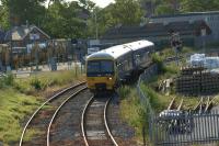 FGW 165132 approaches West Ealing Jct with a service from Greenford to Paddington on the late afternoon of 04 June 2011. The level crossing the DMU has just crossed gives access to the Network Rail Depot on the left.<br><br>[John McIntyre 04/06/2011]