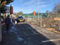 The overbridge at Baillieston seen a few days before it was due to be closed for demolition and replacement. Work was still in progress on diverting the many utilities over the temporary pedestrian bridge.<br><br>[Colin McDonald 06/02/2018]