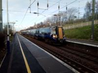 An Edinburgh to Dunbar Scotrail service calls at Musselburgh on 25th January 2018. This is the only stop for these few daily services, though it's not clear why. A sign at the top of the ramp tells you it's a mile and a half to the town centre. If only you could catch a train, as local wags no doubt say.<br>
<br>
<br><br>[David Panton 25/01/2018]