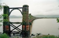 View north of the gently curving southern end of the Alloa Bridge in 1993. The southern part of the River Forth is largely mudflats with the navigable channel, and former swinging portion of the bridge, in the northern part of the river.<br><br>[Ewan Crawford //1993]