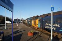 37402 waits patiently with the late running Barrow to Carlisle service at Whitehaven on 28 January 2018. The cause of the late running was nothing to do with the train on this occasion but a problem with the points on the single line section between Parton and Harrington. <br>
The local signalbox (Bransty) can be seen in the distance behind the lamp post.<br><br>[John McIntyre 26/01/2018]