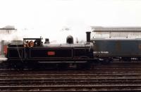 LNWR 0-6-2T <I>Coal Tank</I> 1054 (BR 58926) seen at Chester station part way through the 1986 <I>Cam Camwell 80th Birthday</I> special. The steam loco had brought the three coach train here from Shrewsbury and uncoupled to go across to the lines shown for servicing and watering before taking the tour on to Stockport.<br><br>[Mark Bartlett 18/10/1986]