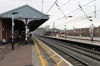 Looking south at Grantham on 26th January 2018. Over on the right EMT 158813 has called at the island platform on a service for Norwich that will shortly join the main line for the sprint to Peterborough.<br><br>[Mark Bartlett 26/01/2018]