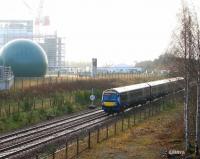 ScotRail 170403 forming the 0845 Tweedbank - Edinburgh running north between Shawfair and Newcraighall on 4 February 2018. Beyond the blue sphere of the food waste processing plant is part of the large building site surrounding the under construction Edinburgh and Midlothian Recycling & Energy Recovery Centre.<br><br>[John Furnevel 04/02/2018]