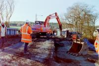 Demolition of the old girder bridge and decking at Merryton Junction before replacing with new concrete structure in March 2005. This bridge carries the A72 Hamilton to Lanark road<br><br>[Gordon Steel /03/2005]