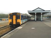 A misty morning at Par station in June 2002, with 150246 standing alongside platform 3 with the next Newquay branch train. <br><br>[Ian Dinmore 01/06/2002]