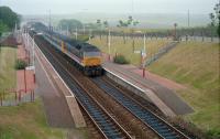 A southbound 47 (no number obvious, just an unreadable name plate) passing through Pertlethen station in 1989.<br><br>[Ewan Crawford //1989]