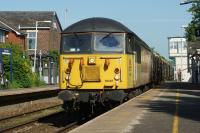 Colas Railfreight no.56087 passes Bamber Bridge on 17 May 2014 whilst working the 6J37 Carlisle Yard to Chirk log train.<br><br>[John McIntyre 17/05/2014]