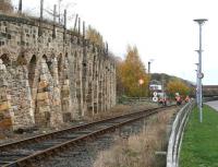 Dating from 1856, the Victorian coal drops at Shildon are now listed structures included within the grounds of the railway museum. View east towards Spout Lane road bridge and the main exhibition hall on 23 November, 2010, with maintenance work in progress around the foot crossing linking the museum site with Shildon station.<br><br>[John Furnevel 23/11/2010]