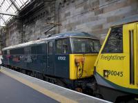 Caledonian Sleeper locomotive (or <I>Electric Thunderbird</I>) 87002 <i>Royal Sovereign</i> photographed on its arrival at Glasgow Central after rescuing Freightliner 90045 which failed at Tring while hauling the northbound Lowland Caledonian Sleeper. 87002 was the Lowland Sleeper's ECS into Euston<br><br>[Colin McDonald 10/02/2018]