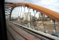 Crossing the River Irwell on the bridge carrying the Ordsall Chord on 17 February 2018, some two months after opening. Photographed from a train running between Oxford Road and Victoria on a service to Leeds via Bradford. [See image 60177]<br><br>[John McIntyre 17/02/2018]