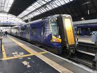 380021, one of the ‘borrowed’ Electric Multiple Units which are deputising for the delayed new class 385 EMUs, seen about to slope off to Edinburgh from Platform 4 at Queen Street. <br><br>[Colin McDonald 10/02/2018]