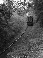 08761 nears the A92 bridge having just passed over Prestonhall level crossing with china clay for Tullis Russell.  <br>
<br><br>[Bill Roberton //1991]