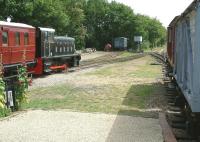 Looking east from the end of the platform at Brockford and Wetheringsett on the Mid Sussex Light Railway on a summer afternoon in July 2002. Stabled on the left is 1952 built Ruston 165 0-4-0DM 'Alston'. <br><br>[Ian Dinmore 20/07/2002]