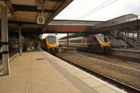 North and southbound Cross Country Voyagers pass whilst calling at York on the afternoon of 12 July 2014.<br><br>[John McIntyre 12/07/2014]