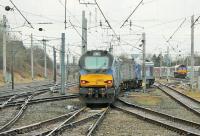 Although several crew training runs took place in January 2018 the plan to use Class 68s on Cumbrian Coast services is reported to have fizzled out, for a variety of reasons, and the Class 37s continue on both diagrams. On 19th January 68003 <I>Astute</I> was on the rear of a two coach train that had come round the coast line and was just going into the sidings at Carnforth for a lunch stopover prior to returning. 68029 had been the lead locomotive on the outward leg. DB 66018 can also be seen stabled on the right. <br><br>[Mark Bartlett 19/01/2018]