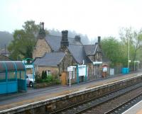 The attractive station building at Riding Mill, Northumberland, opened by the Newcastle and Carlisle Railway in 1835. View is west from the footbridge on a damp and misty May morning in 2006. <br><br>[John Furnevel /05/2006]