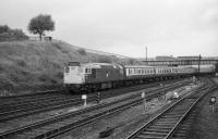 A Glasgow to Edinburgh push-pull service passes Eastfield MPD and under the Caledonian Railway viaduct on 16 September 1972. The Class 27s involved were 5400 leading and 5374 on the rear. There must have been a loco change since 5374 had been on shed earlier in the day [See image 11168].<br><br>[John McIntyre 16/09/1972]