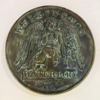 On view at Waterloo station concourse - an enlarged replica of the Waterloo Campaign Medal, given to all the Allied soldiers. The plaque was installed on behalf of the Waterloo 200 Charity by the London Mint Office Limited, on the 10th June 2015.<br><br>[Colin McDonald 08/02/2018]