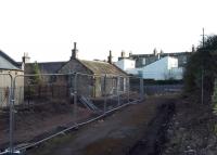 With the demolition of a former Driving Test Centre (a glorified shed) we<br>
once again have a street view of the former Joppa station building. Would<br>
make a nice little home, with a bit of work. The pole on the right has<br>
insulators at the top and was probably a lamp with a cable strung from the<br>
station building. 16th February 2018. [See image 14178] [Ref query 21 February 2018]<br>
<br>
<br><br>[David Panton 16/02/2018]