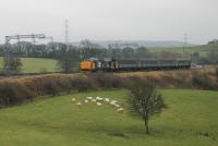 37403 <I>Isle of Mull</I> heads the Preston to Barrow train across the embankment at Bay Horse on 29th December 2017. Although a number of Northern drivers have recently been trained on Class 68s it now appears the Class 37s will continue in charge of these trains for the time being. <br><br>[Mark Bartlett 19/02/2018]