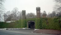 The Guthrie Gate is a railway bridge dating from 1839. The Arbroath and Forfar Railway passed over the main entry to Guthrie Castle here and the bridge design was to suit Mr Guthrie. The bridge was to carry the double track mainline to Aberdeen until closure of the Strathmore route.<br><br>[Ewan Crawford //1996]