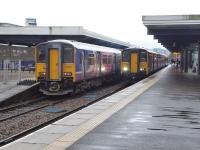 Clitheroe services pass at Blackburn on 14th February 2018. Both trains had three coaches, formed of a Class 150/2 and a 153. That on the left in Platform 4 is heading for Manchester Victoria via Bolton and the other in Platform 2 for the Ribble Valley. <br><br>[Mark Bartlett 14/02/2018]