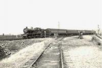 Looking along the line from Barrhead Central towards Barrhead South Junction in October 1957. The train is a St Enoch - Kilmarnock local, hauled by 2P 4-4-0 40661. [Ref query 22 February 2018]  <br><br>[G H Robin collection by courtesy of the Mitchell Library, Glasgow 24/10/1957]