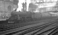 Snowplough fitted Black 5 44993 brings the 6.55am ex-Glasgow St Enoch into Carlisle on a cold December morning in 1961.<br><br>[K A Gray 22/12/1961]