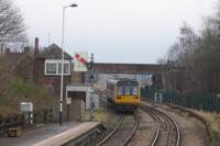 The 12.25 Bishop Auckland to Saltburn departs from Shildon on 8 February 2018, with the 'Locomotion' out-base of the National Railway Museum in the distant right.<br><br>[David Spaven 08/02/2018]