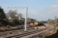 66512, on an electrification ballast train, stands on the Down Line to the east of Poulton station on 23rd February 2018. [See image 60646] for the same location during the previous summer.   <br><br>[Mark Bartlett 23/02/2018]