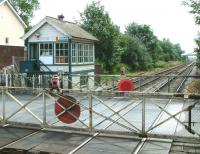 View from the up platform at Cantley, Norfolk, in 2002, looking south east over Station Road level crossing towards Lowestoft.<br><br>[Ian Dinmore 19/07/2002]