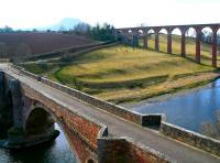 View south west over the Tweed from the A68 on 24 February 2018. In the foreground is part of Drygrange Old Bridge, with the south end of Leaderfoot Viaduct standing beyond. The Eildon Hills are visible through the haze in the background. <br><br>[John Furnevel 24/02/2018]