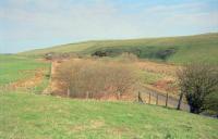 Falahill Summit looking north in 1997. The former line was to the right and the sidings to the left. The former railway cottage can be seen further along the line, on the left.<br><br>[Ewan Crawford 20/04/1997]