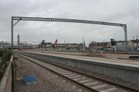 A particularly long gantry has been erected over six tracks at Blackpool North, seen here on 2nd March 2018 with work still proceeding on the new platforms. Note the new signals on island Platform 5/6. The station reopens to DIESEL trains on 26th March but electric services will only begin with the May 2018 timetable. <br><br>[Mark Bartlett 02/03/2018]