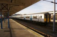 EMU 317338 sits in the middle road at Kings Lynn in the cold February sunshine. 24th February 2018.<br><br>[John McIntyre 24/02/2018]