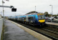 The eye-catching BTP emblazoned 170 calls at Montrose on 7 November with a Glasgow service. The odd hanging item on the near platform is an OFF indicator for the conductor. These seem to be appearing in locations which never had them before. Once the train has pulled out we are left with the bird sounds from Montrose Basin on the left. To passengers unfamiliar with the location the 'sea' must seem disorientatingly to be on the wrong side ... <br><br>[David Panton 07/11/2017]