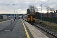 Under the new wires at Salwick, 150211 hurries through the refurbished station on a Preston to Blackpool South service on 7th March 2018. [See image 46105] for a similar view in 1981. <br><br>[Mark Bartlett 07/03/2018]