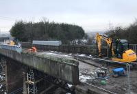 With signs of the previous week's heavy snowfall all but gone, work on the demolition of the Muirhead Road overbridge has resumed, and all seems well for the removal of the steelwork planned for the coming weekend. The corrugated metal of the deck is now exposed on the southern part of the bridge.<br><br>[Colin McDonald 05/03/2018]