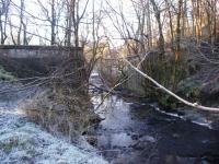 The Giffen - Kilbirnie branch of the Lanarkshire and Ayrshire Railway is completely obliterated beyond the abutments of this difficult to access bridge crossing the Powgree Burn just to the west of Brackenhills station.<br>
<br>
The Kilbirnie Branch was built using part of the solum of the former Barkip Railway, which had been associated with the Glengarnock Iron Works.<br><br>[Douglas Blades 08/01/2018]