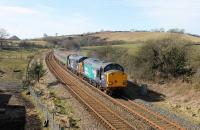 DRS 37423 failed at Bootle on the 0546 Barrow to Carlisle service on 9th March 2018. The train eventually arrived at Sellafield 105 minutes late where it was terminated. Later that day 37059 was sent south to pick up the failed loco and train and is seen here returning to Kingmoor at Bullgill. The previous day it had been announced that one of the Class 37 diagrams will be operated by a Class 68 from 12th March to improve reliability.  <br><br>[Mark Bartlett 09/03/2018]